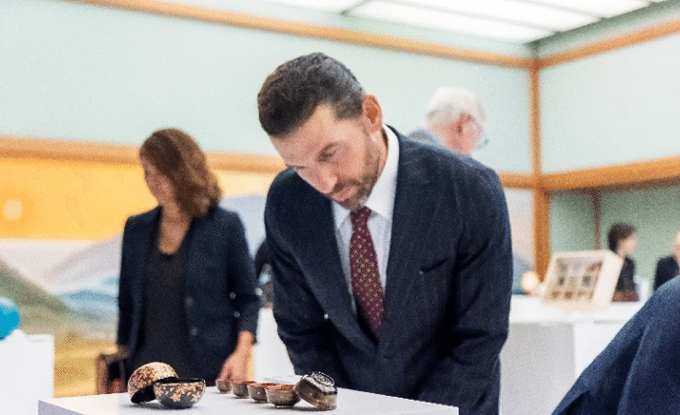 Guests admiring the delicate craftsmanship of the artworks